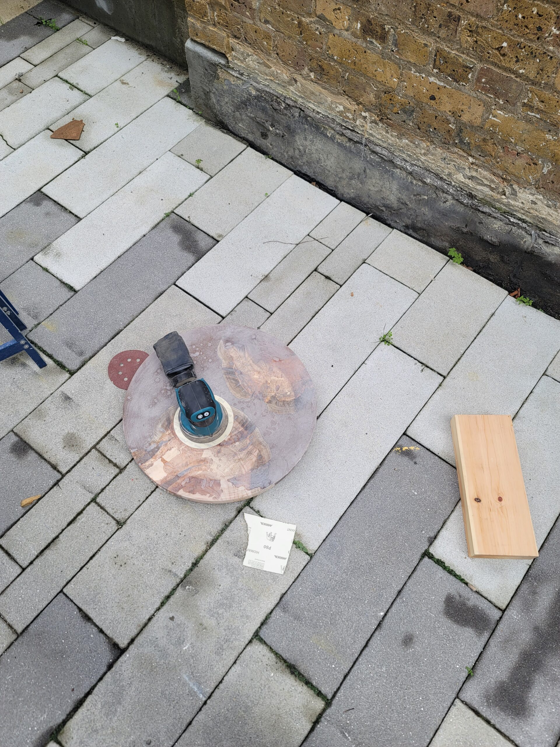 Sanding the surface with small sanding machine